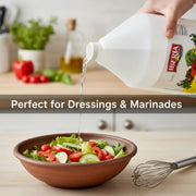 Iberia All Natural Distilled White Vinegar gallon jug with 5% acidity, clear liquid inside a plastic container.