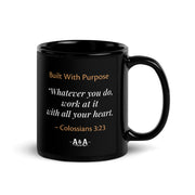 Black glossy Durrett Recovery "Work With All Your Heart" mug with a handle on the right, 11 oz capacity.